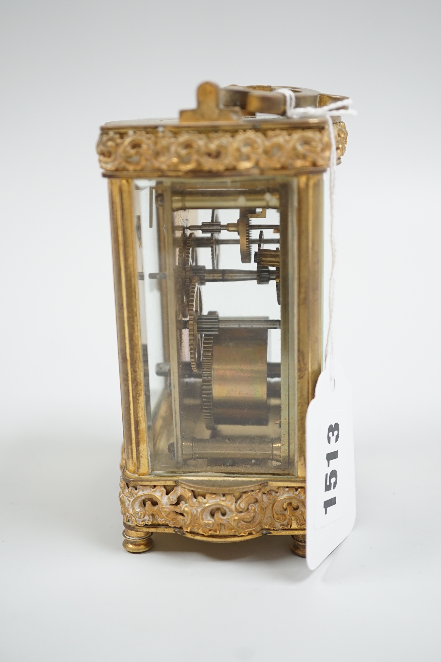 A French gilt brass serpentine carriage timepiece, 12cm high